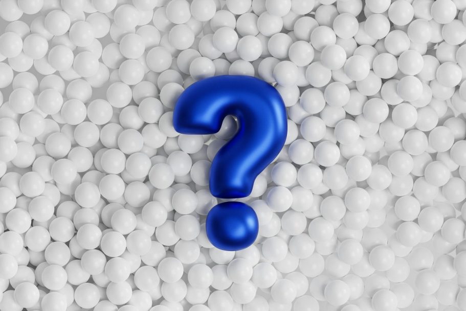 FAQ Blaues Fragezeichen auf einem Hintergrund aus weißen Kugeln.